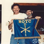 Dock Burke and Ben Trail hold an ROTC flag