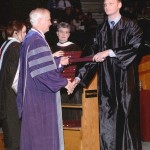 Michael Burke receiving his Texas A&M diploma during graduation